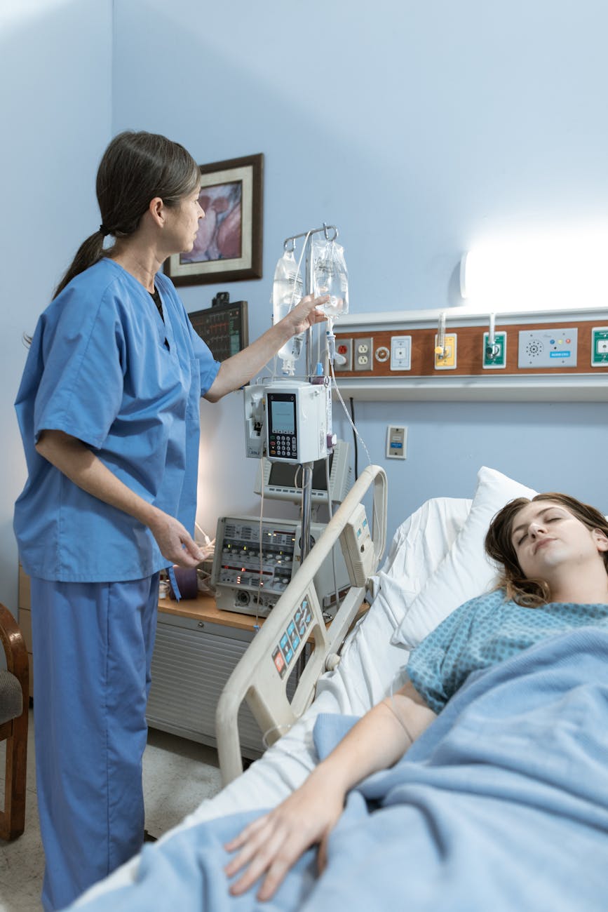 nurse checking the dextrose of a patient